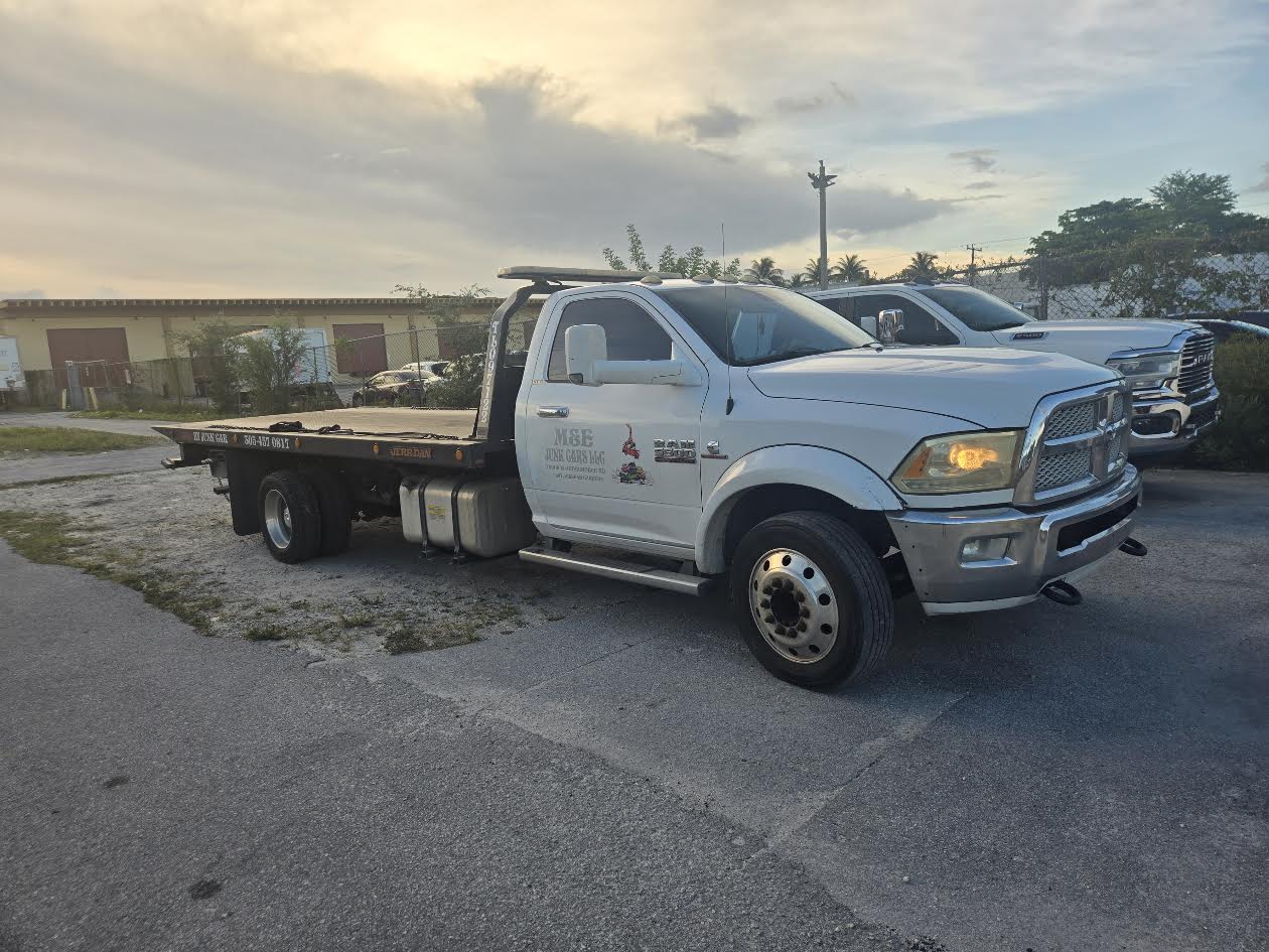 Cash 4 Junk Cars Miami flatbed truck available for qualifying vehicle pickups in Miami-Dade